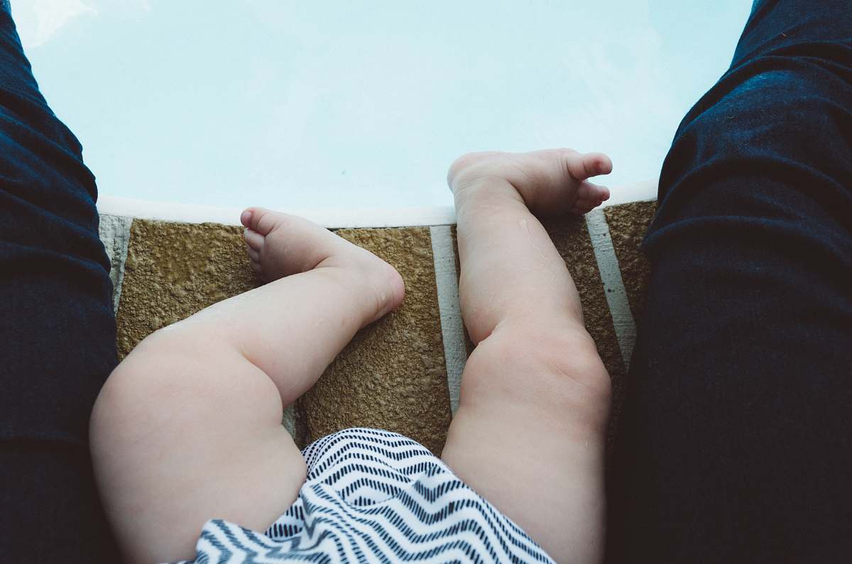 human baby's white and gray striped bottoms person