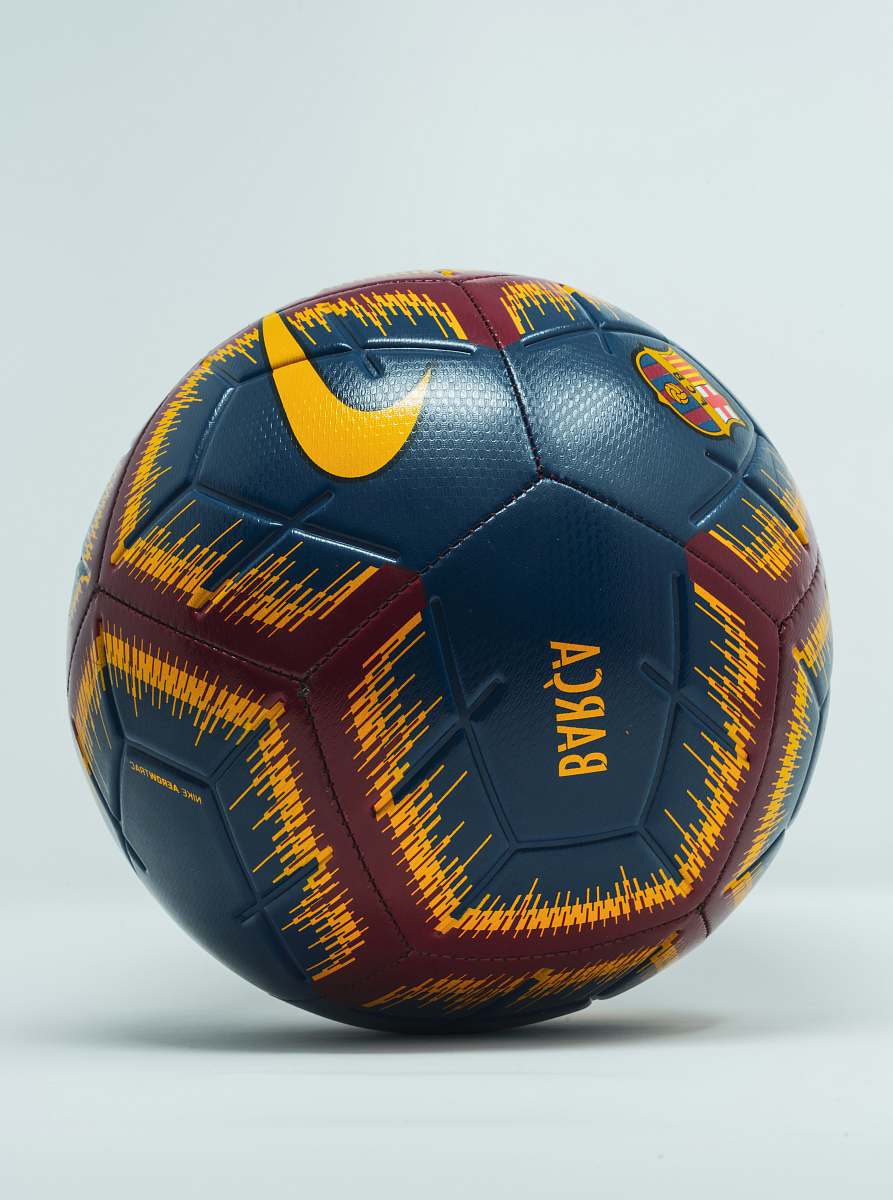 football blue, maroon, and yellow Nike soccer ball soccer
