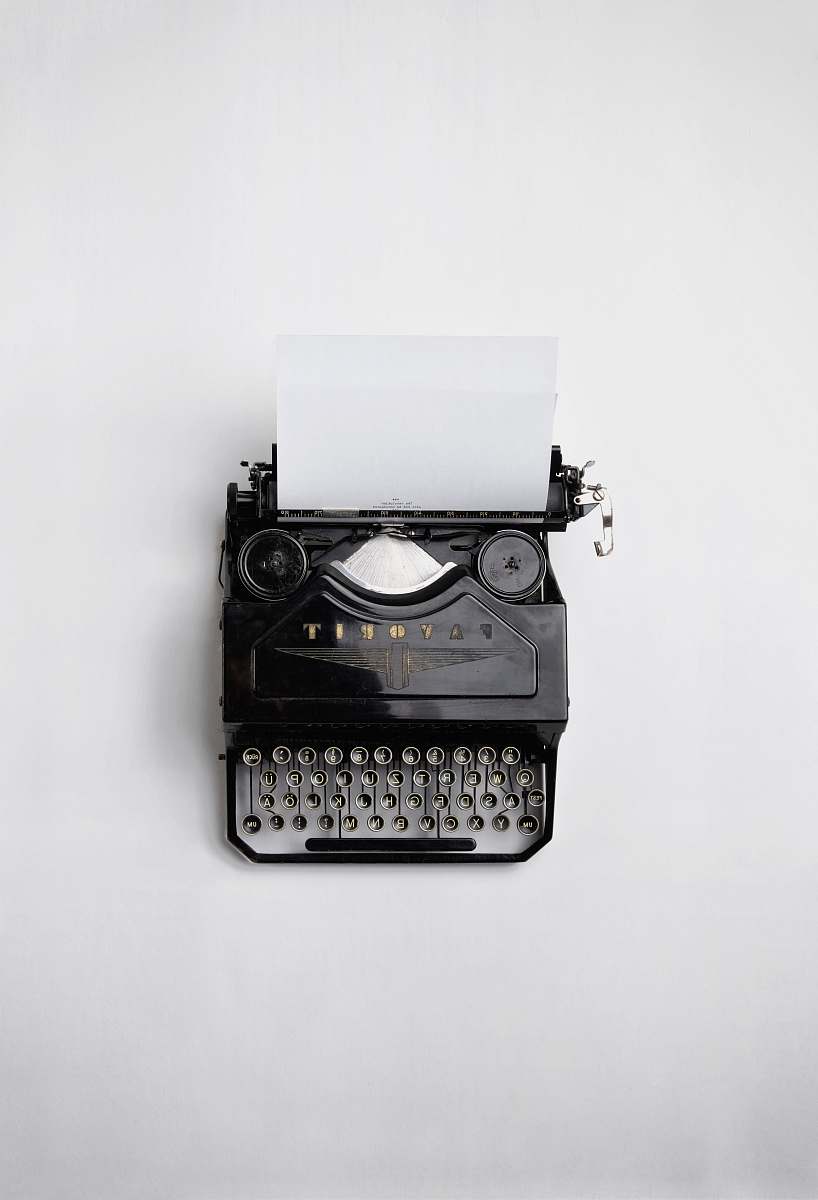 white black Fayorit typewriter with printer paper writing