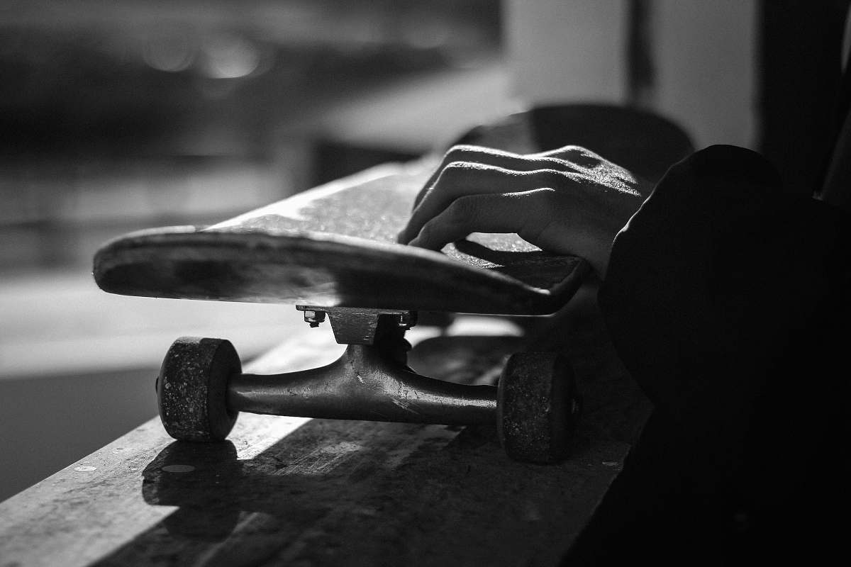 skateboard greyscale photography of skateboard person
