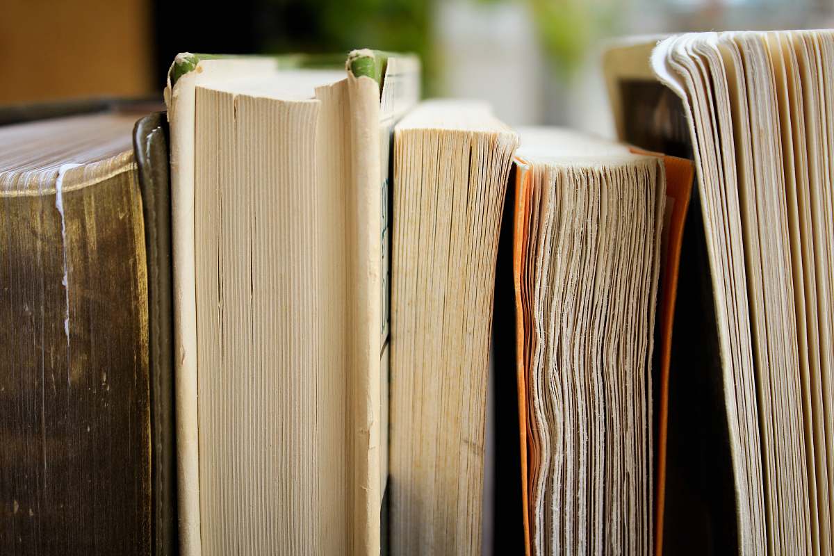 books macro photo of five assorted books reading