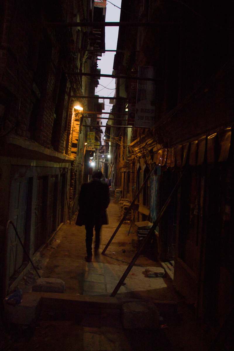 city man walking in the alley road