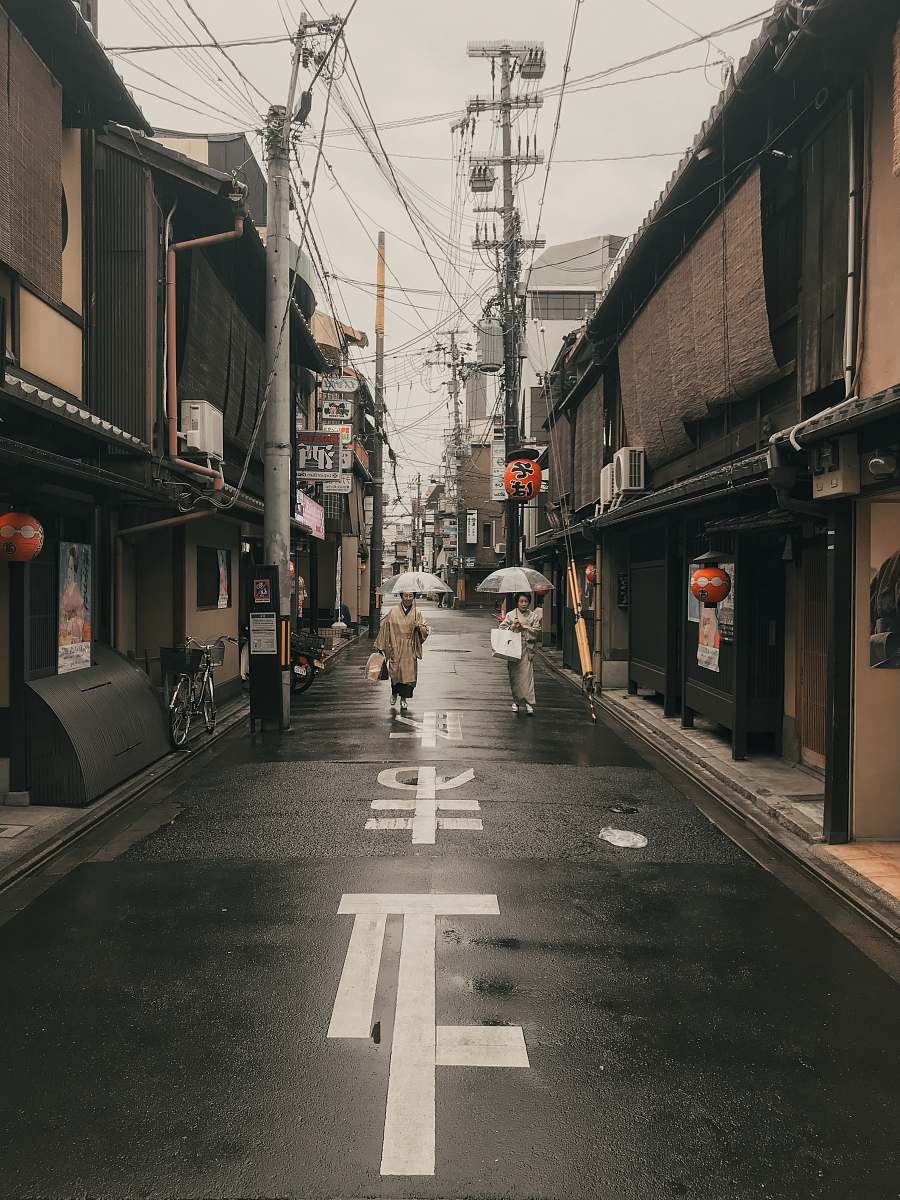 road woman holding grey umbrella urban