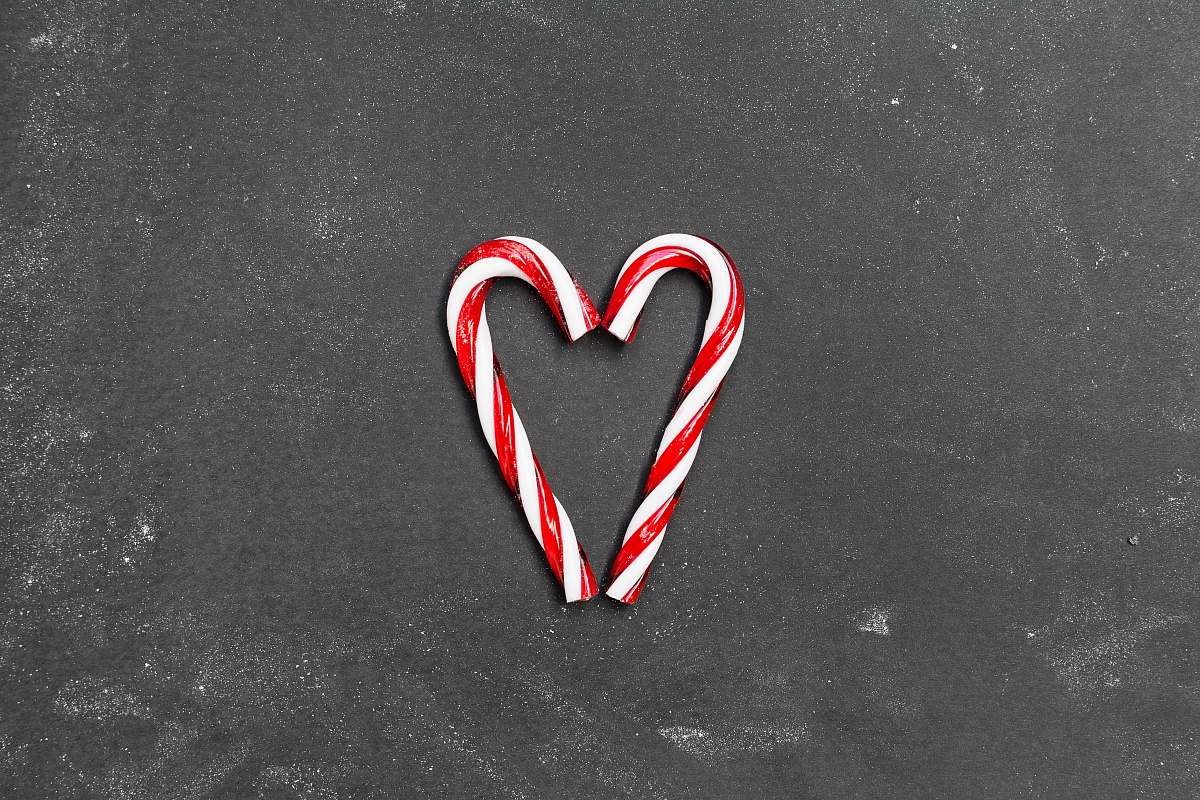 holiday two red-and-white candy canes on gray surface alphabet