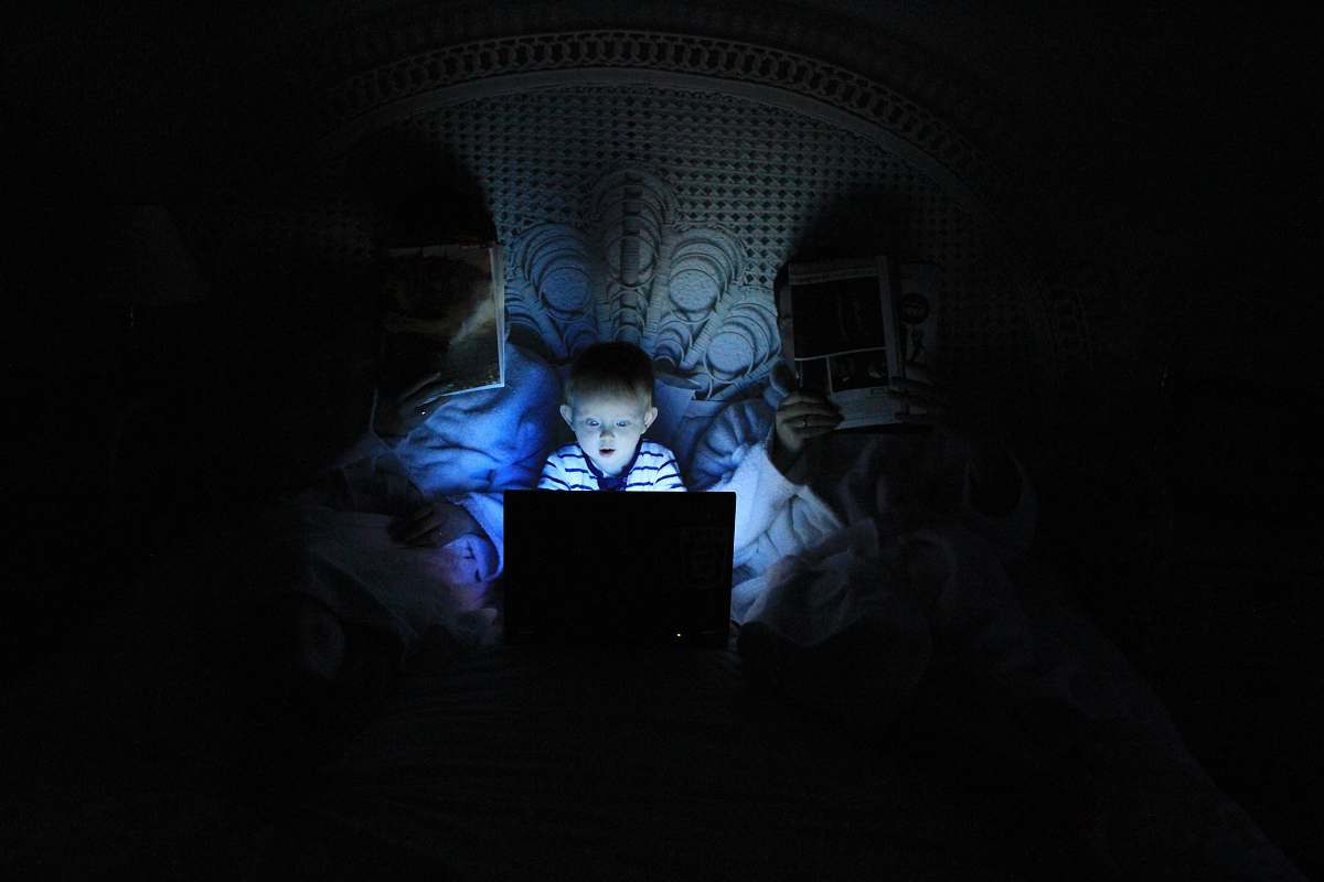 laptop boy playing at laptop inside room kid