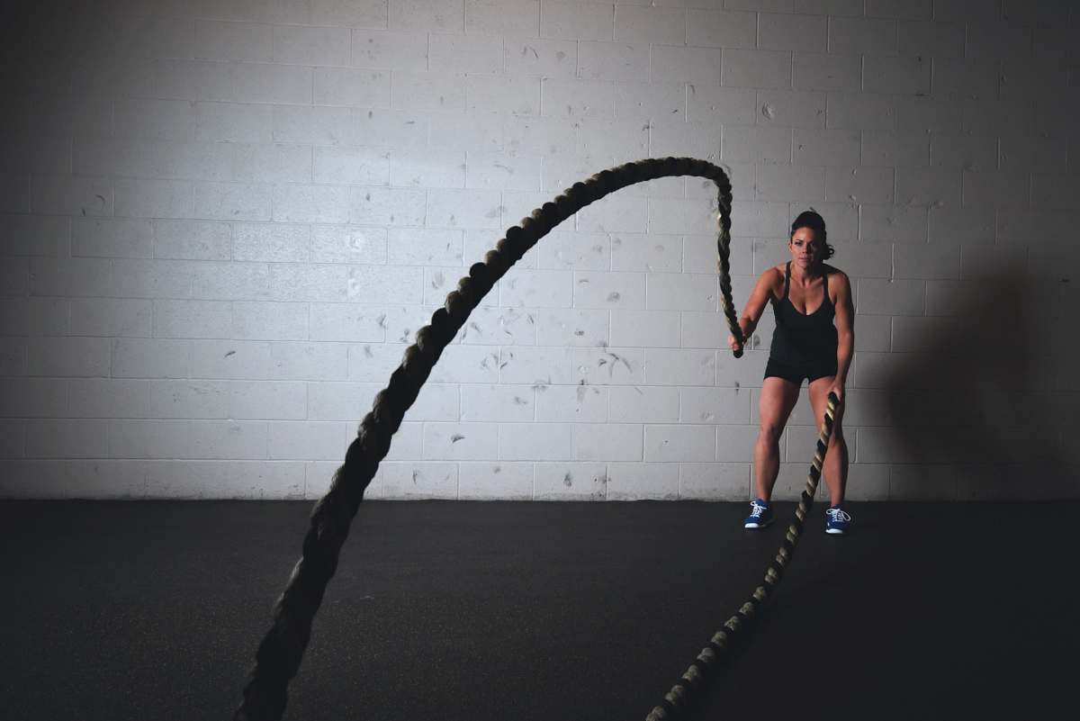 people woman holding brown ropes person