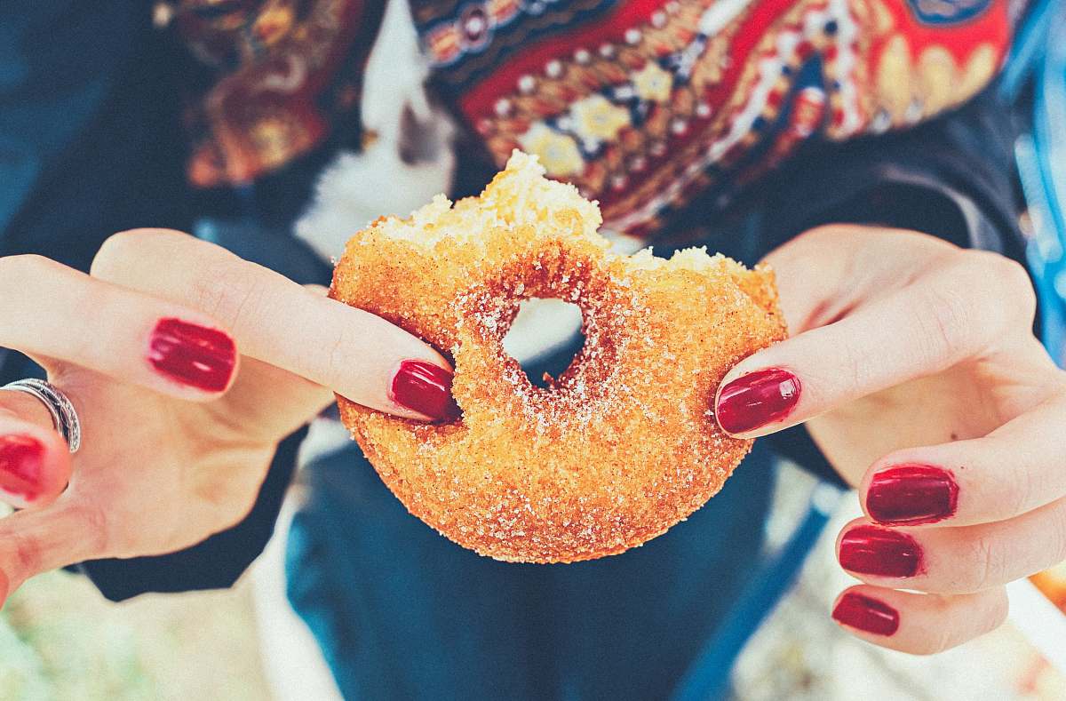 sweet woman holding donut doughnut
