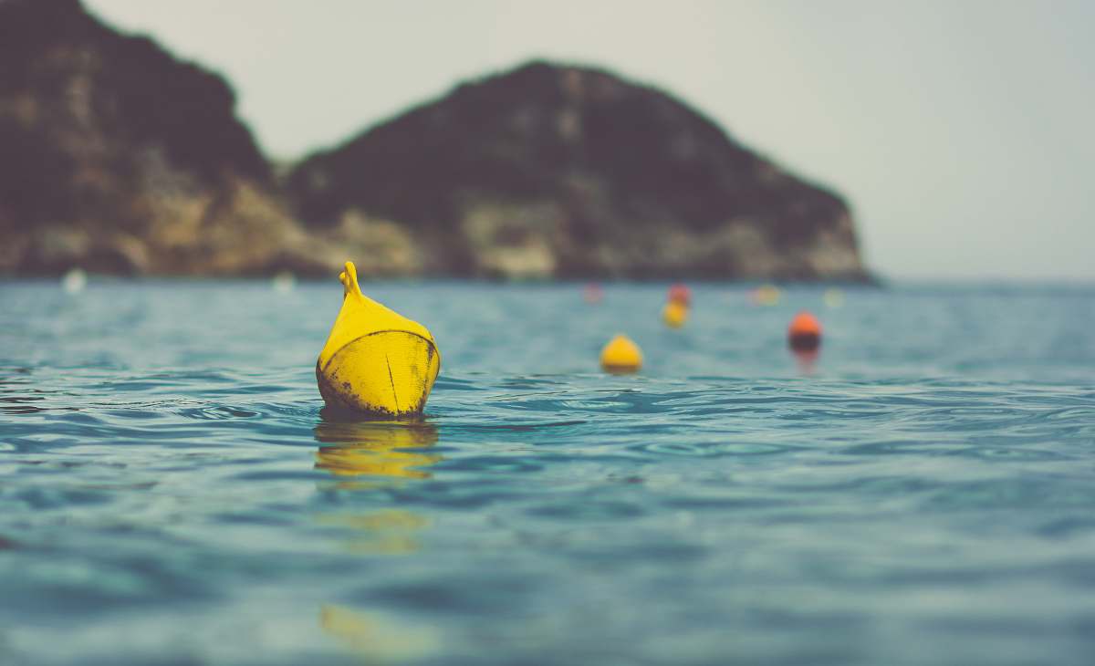 water closeup photo of yellow floating accessory watercraft