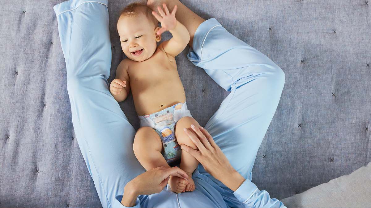 person man playing the baby wearing white diaper diaper