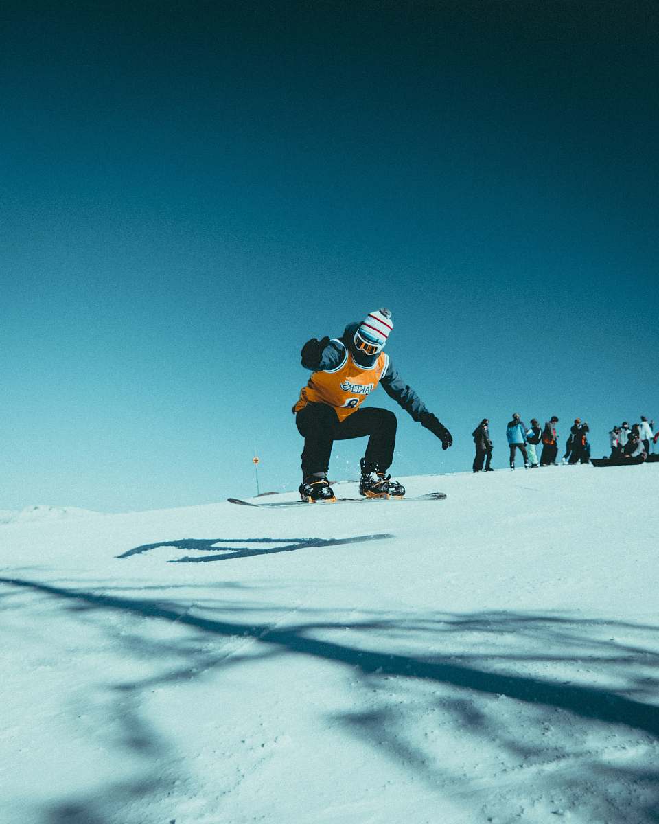outdoors man skiing on snowy field during daytime nature