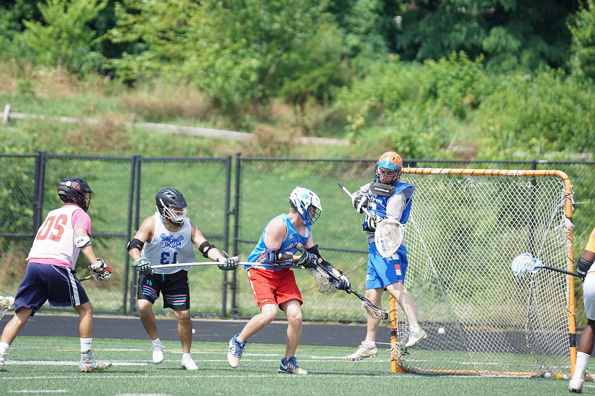 person peopl playing lacrosse during daytime hockey