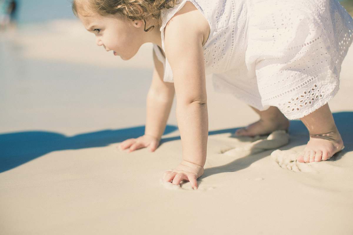 person toddler's playing on sea shore people