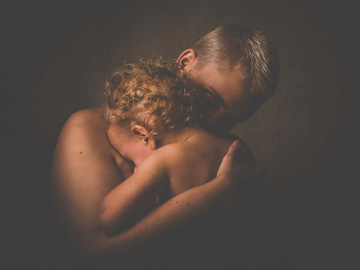 person topless person carrying children people