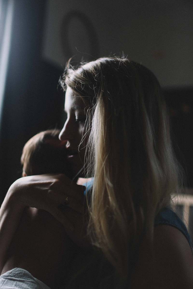 person woman carrying baby people