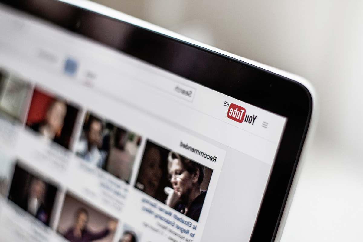 person Youtube application phone