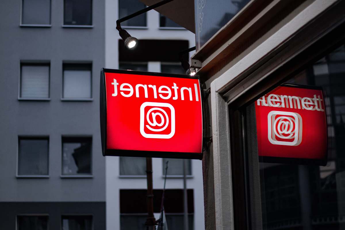 sign Internet LED signage beside building near buildings building