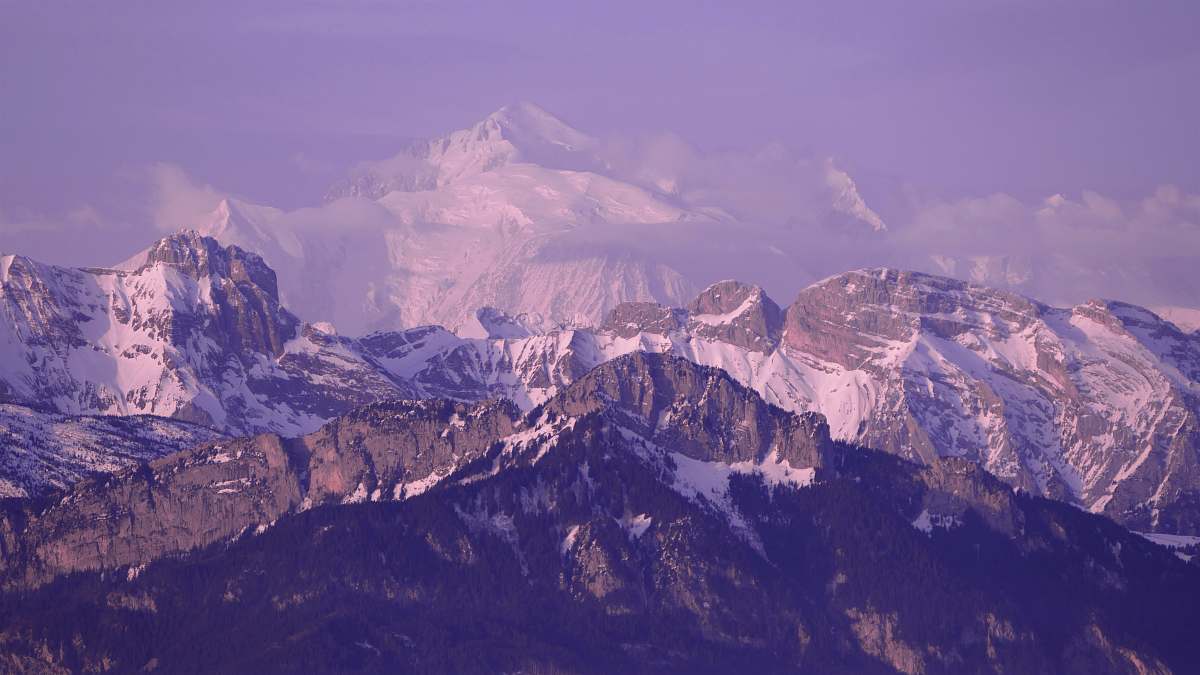 purple landscape photography of mountain covered by snow mountain range