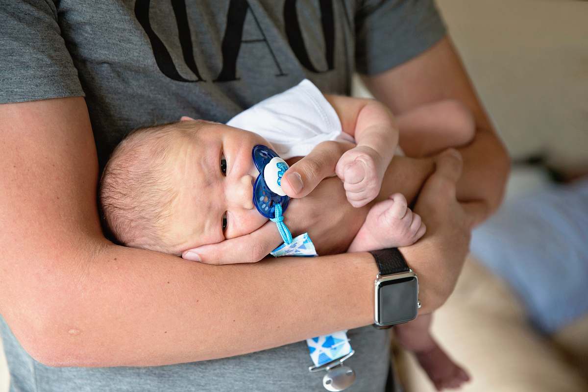 baby man carrying baby human