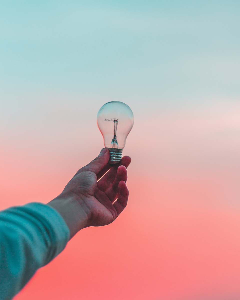 person person holding light bulb idea
