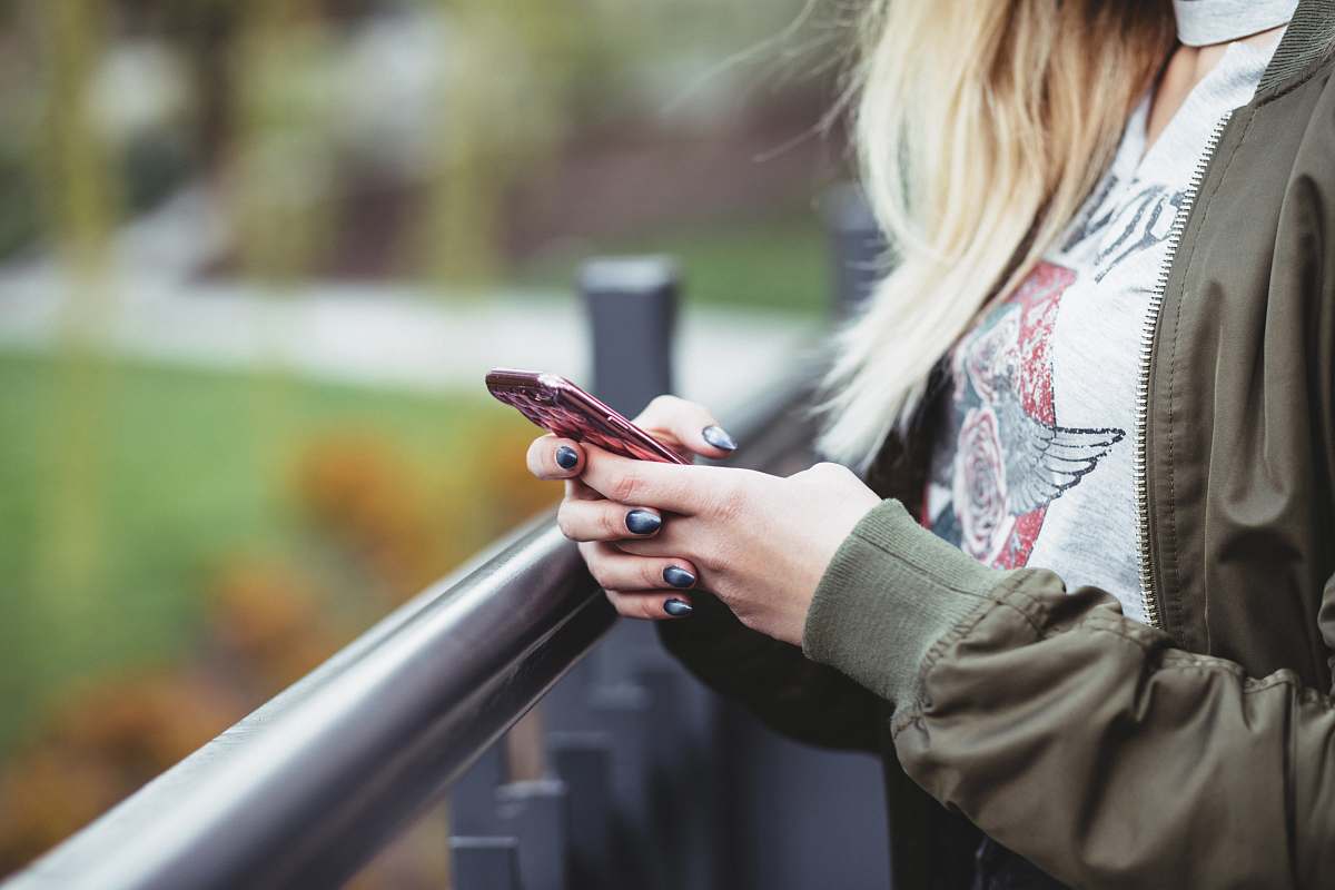 phone woman holding red phone human