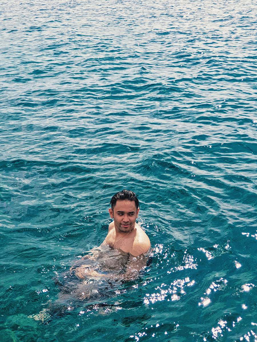 human man in sea during daytime sport