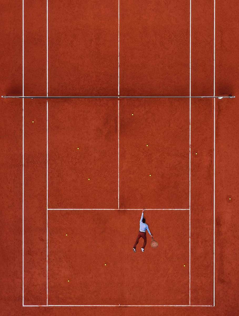 sport man lying on tennis field tennis court
