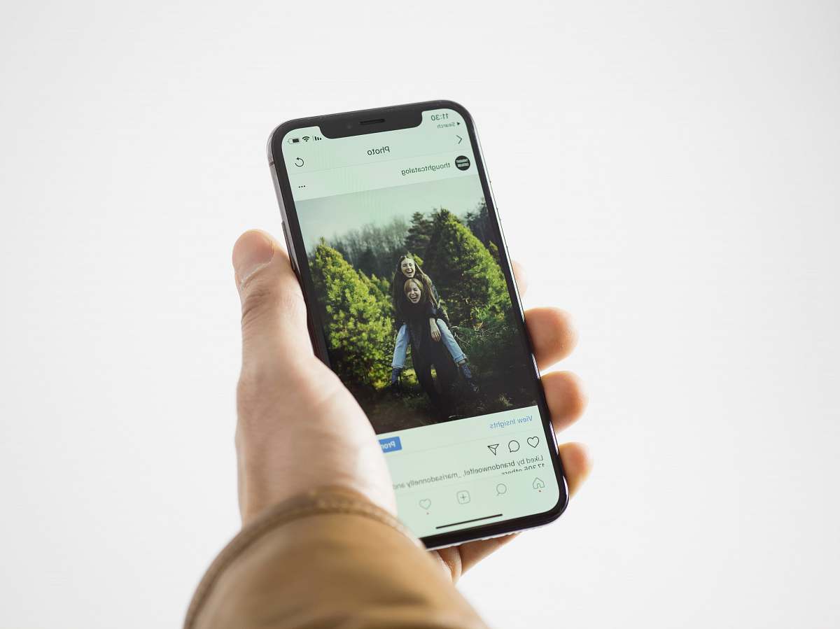 social person using black smartphone hand