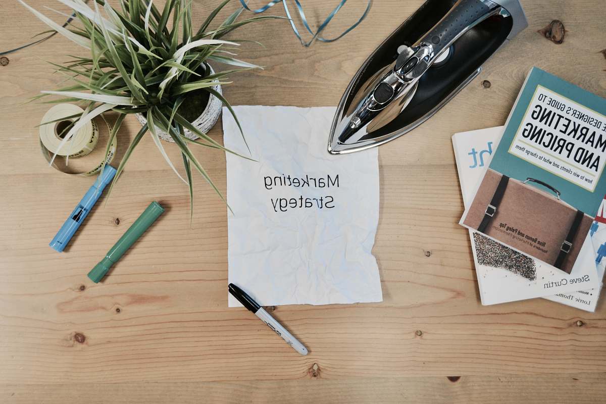 marketing white printing paper with Marketing Strategy text flora