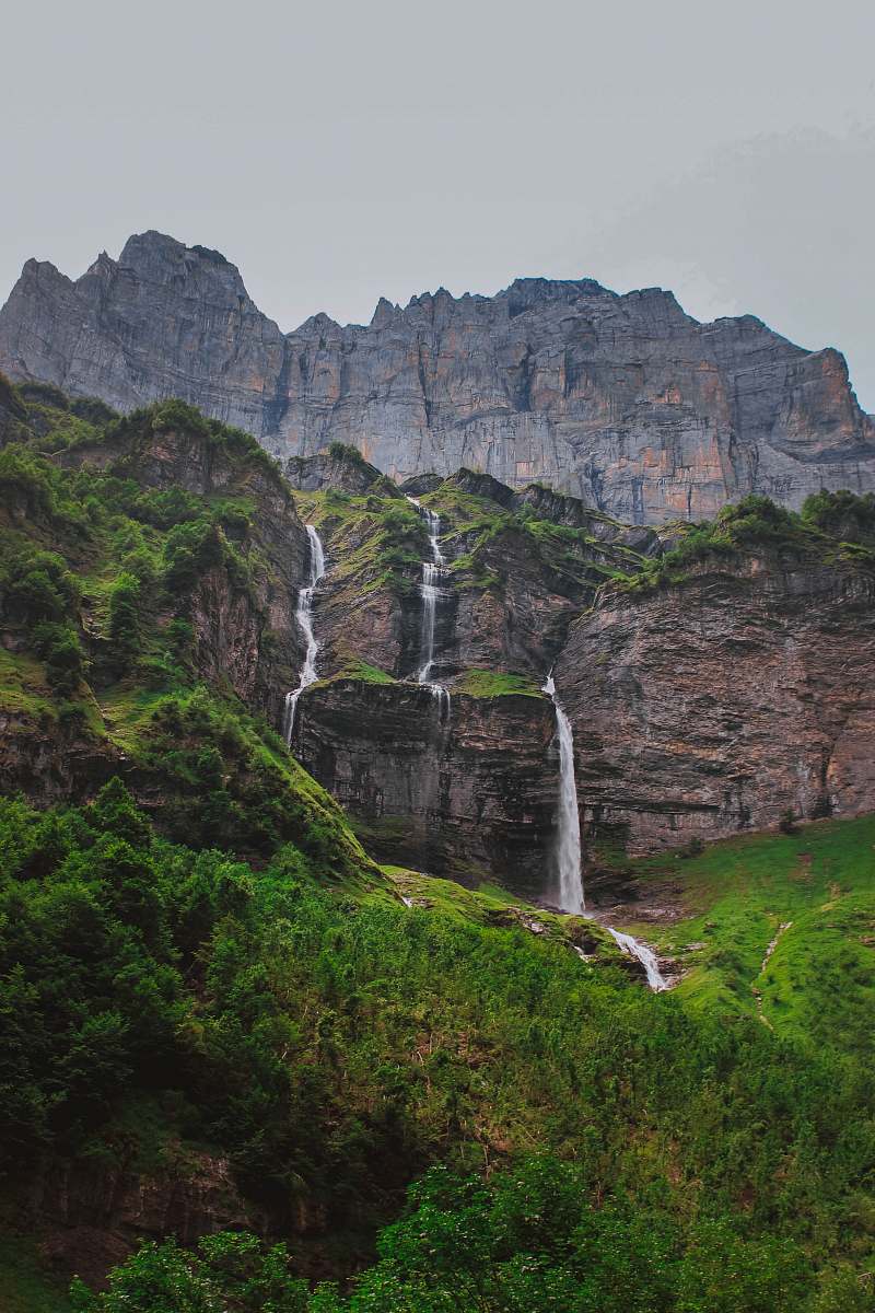 water rock formation above water falls cliff