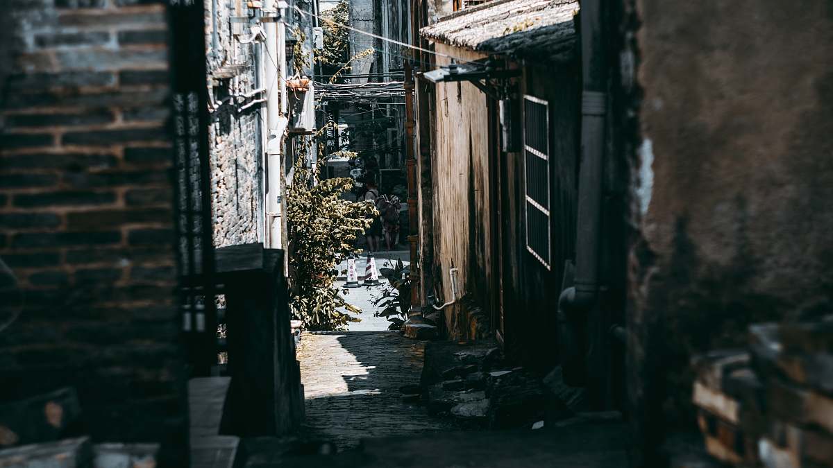 building alley road between houses urban