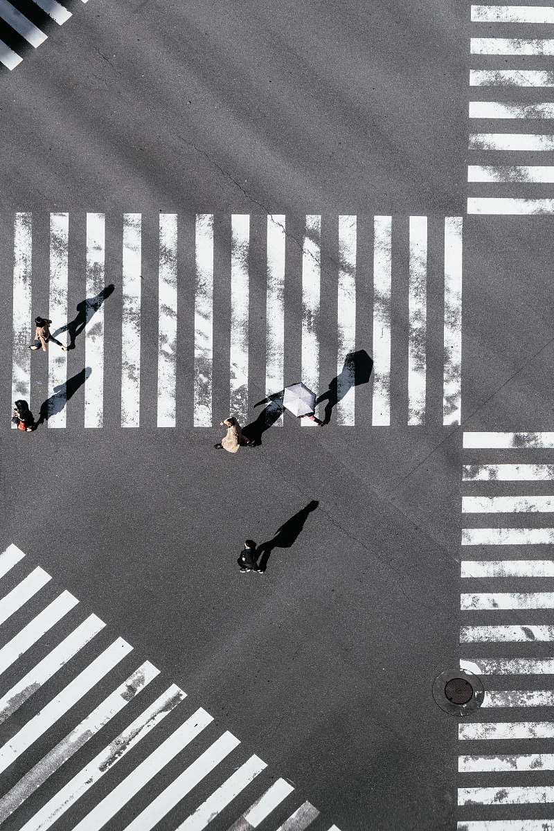 asphalt bird's-eye view photography of people crossing street tarmac