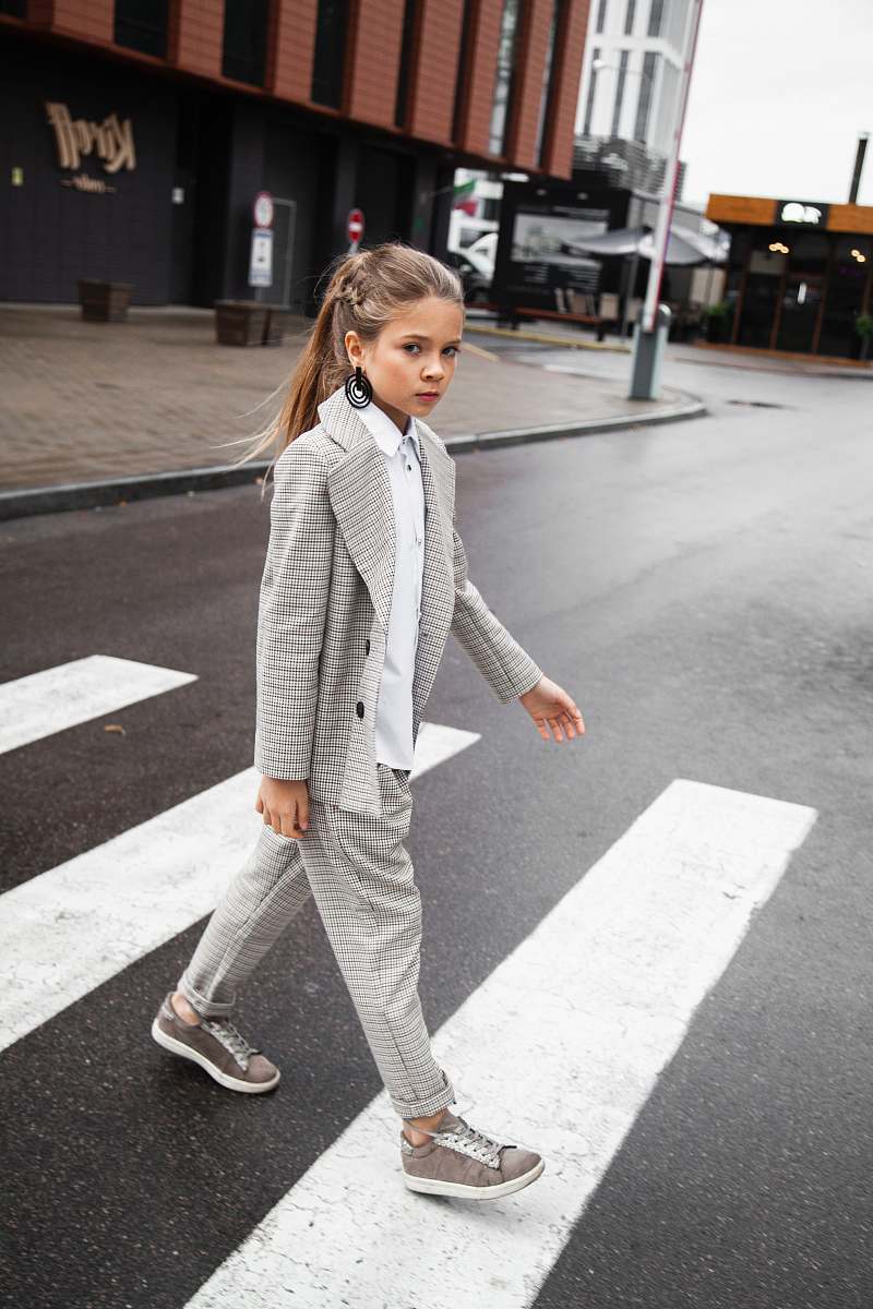 asphalt girl passing on Ped Xing tarmac