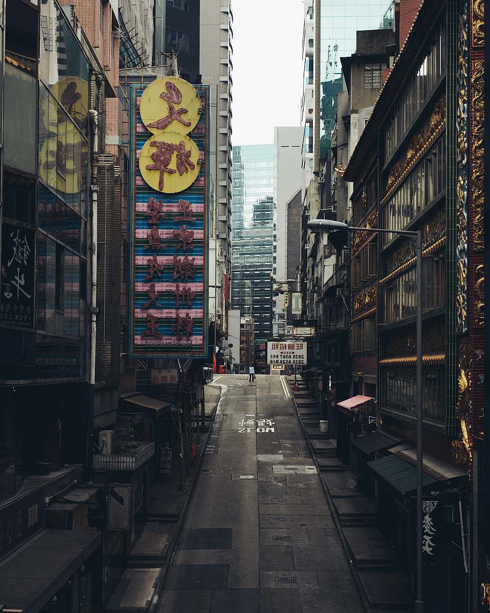 urban gray concrete road between buildings during daytime street
