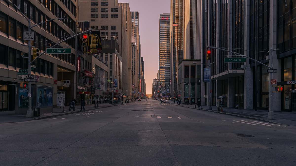 street gray concrete road between buildings city