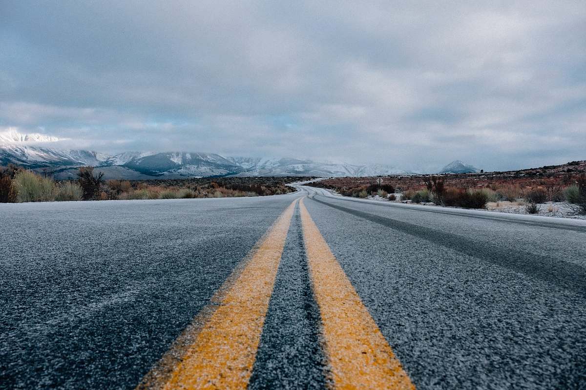 landscape landscape photography of asphalt road under cloudy sky during daytime nature