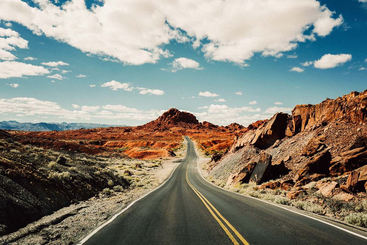 highway road under white and blue sky valley of fire state park