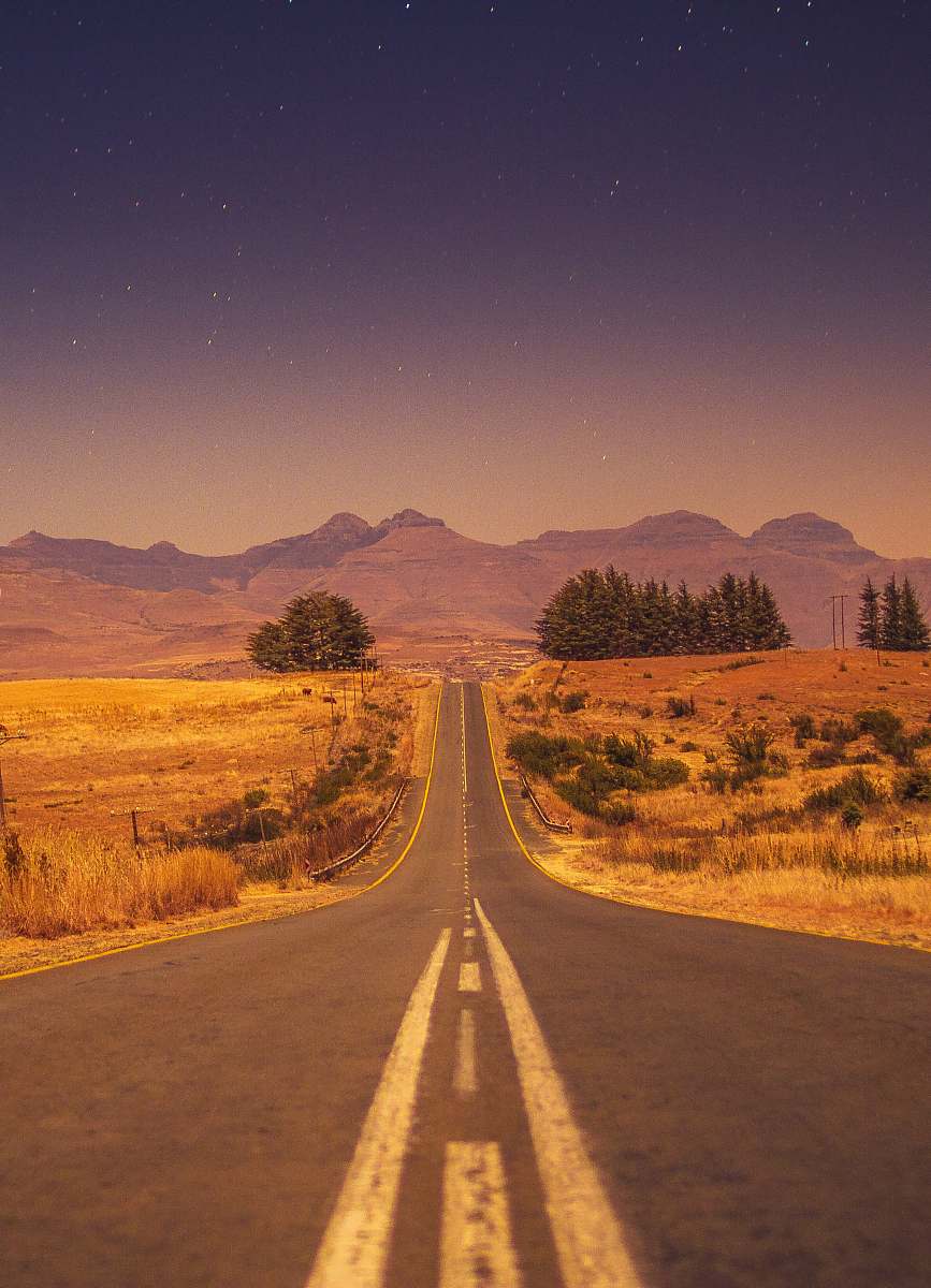gravel view of a long empty road dirt road
