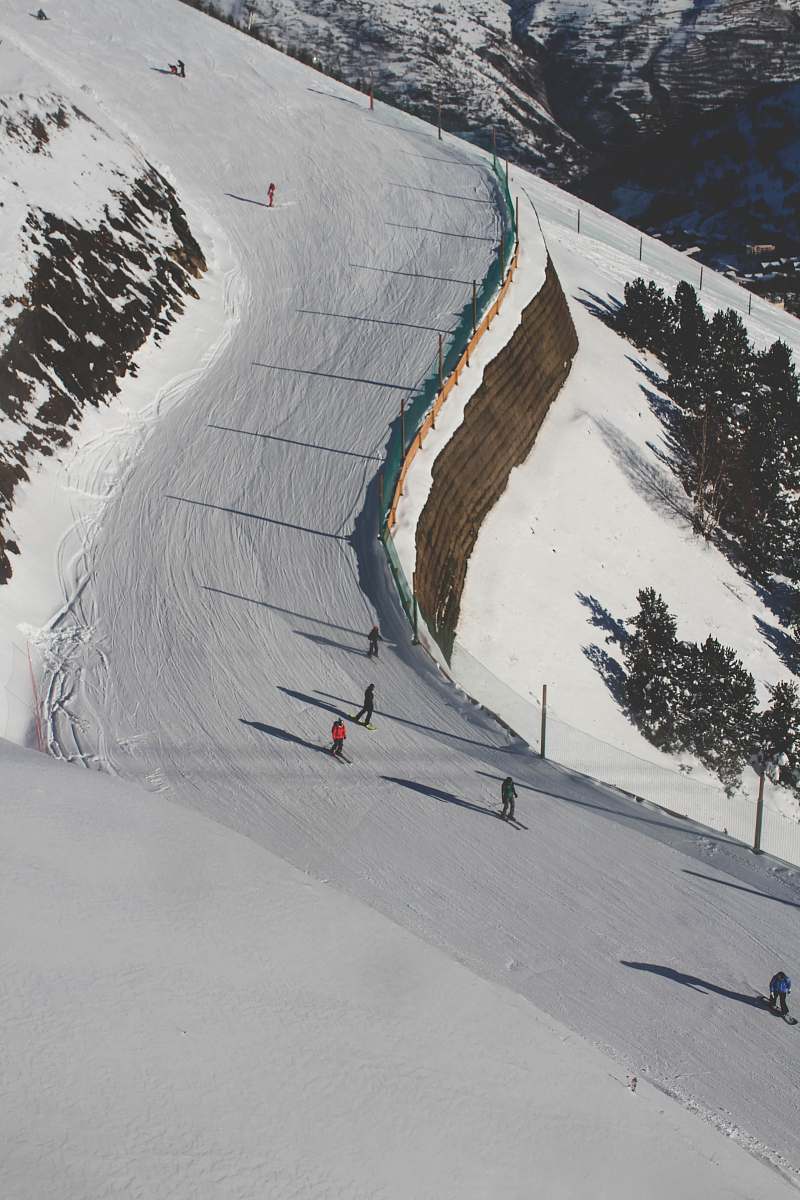 mountain photo of people ice skating during daytime nature