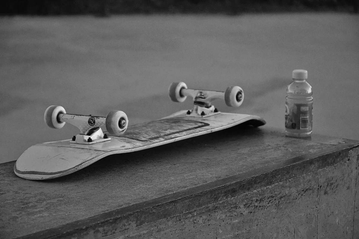 black-and-white grayscale photography of skateboard skateboard