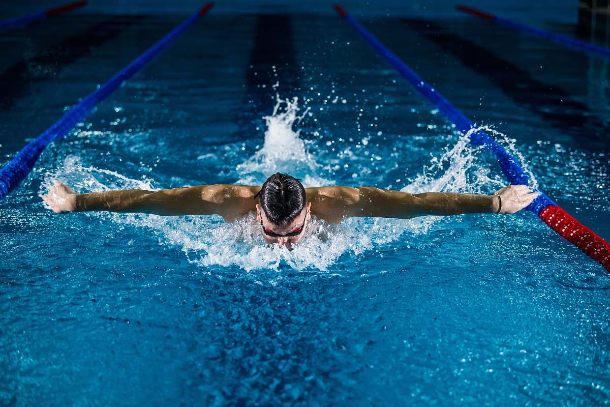 water man doing butterfly stroke swimming