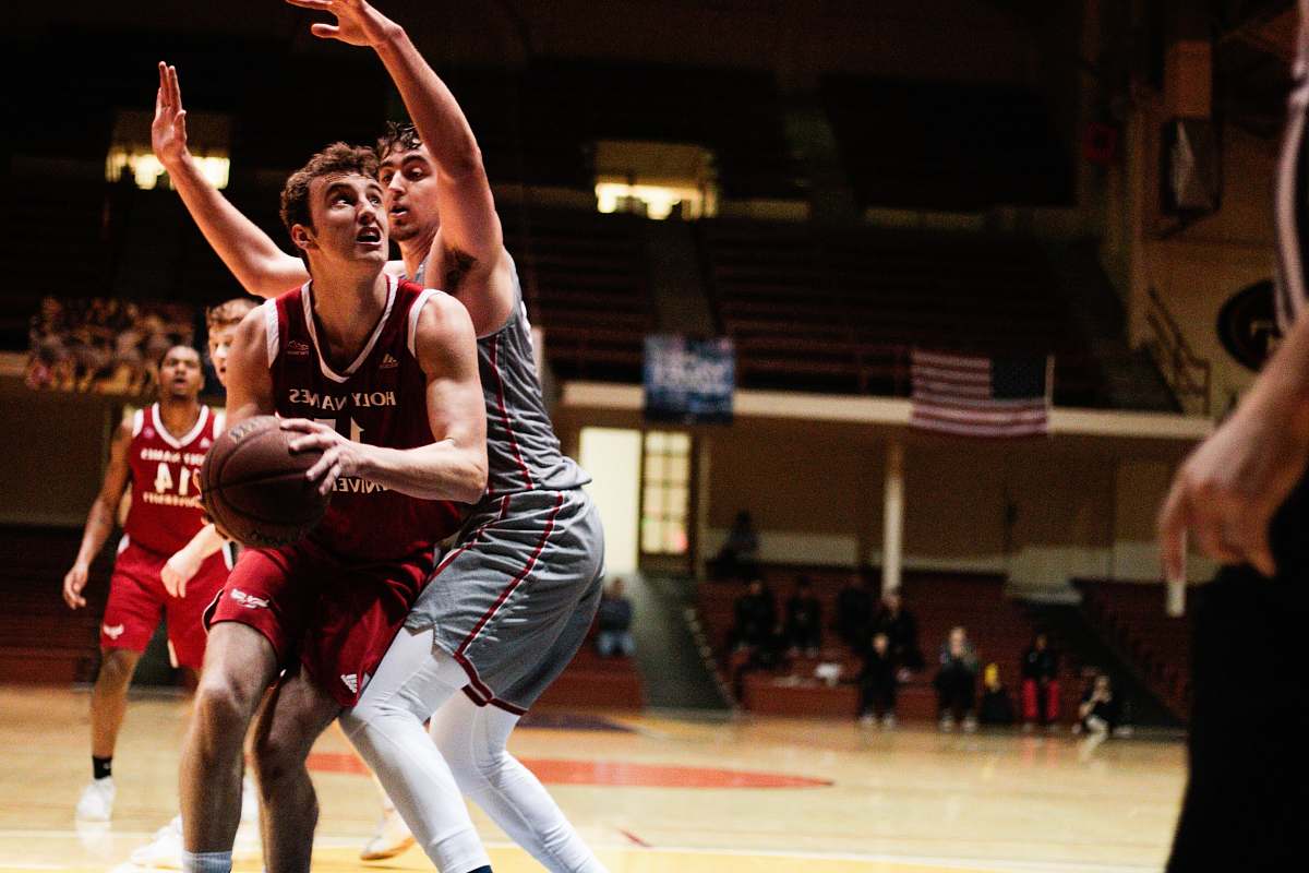 basketball man in red jersey holding basketball team