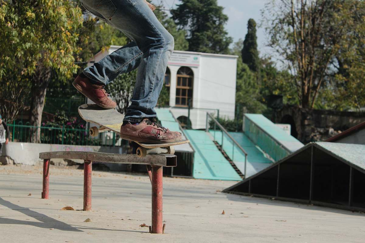 person person skating on rail during daytime skateboard