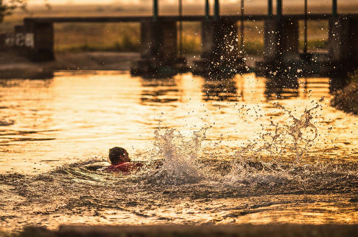 sports person swimming at water water