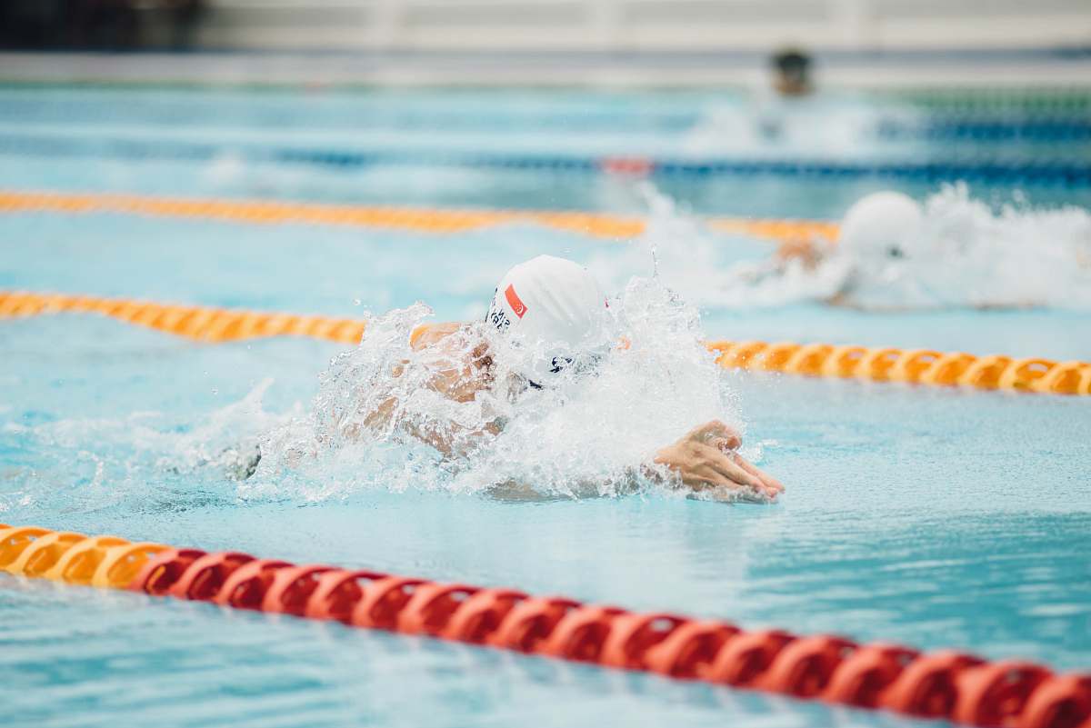 water photo of person swimming swimming