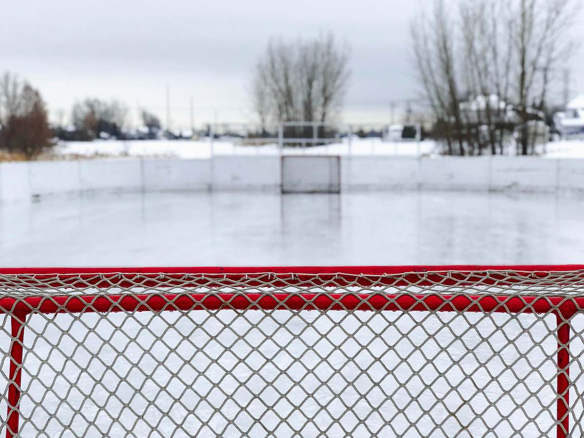 sports red and white goal net on ice field rink
