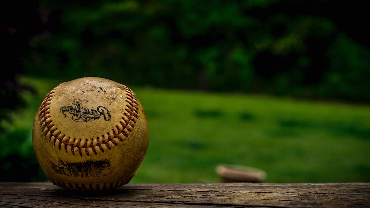 baseball shallow focus photography of baseball sports