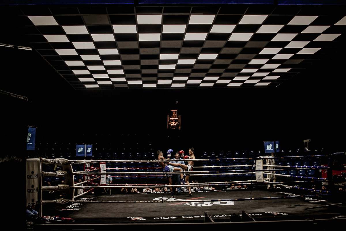 sports two man in blue and red pair of gloves on boxing ring boxing