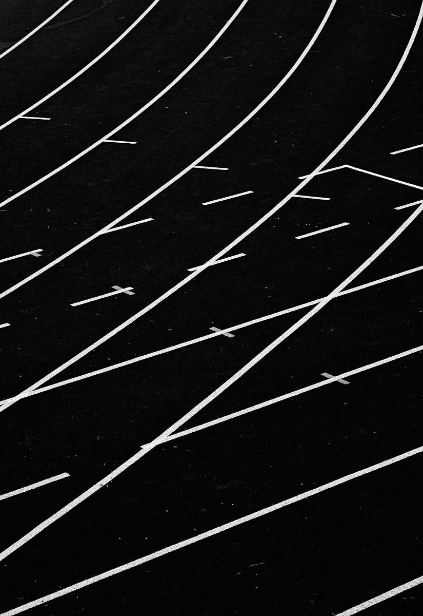 black-and-white white lines on track field black