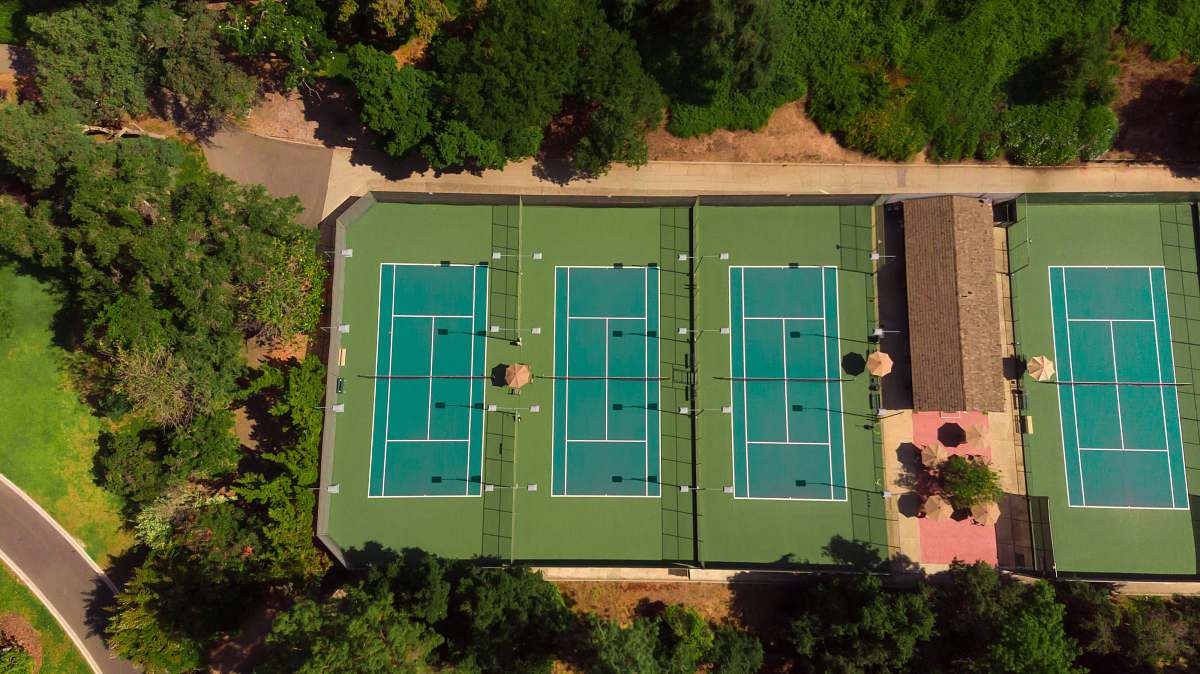 sport aerial photography of three tennis courts tennis court