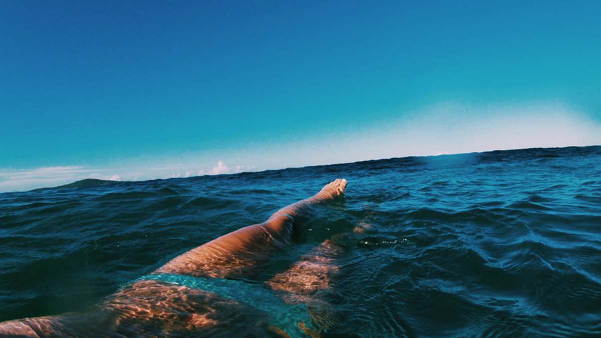 swimming body of water during daytime sport